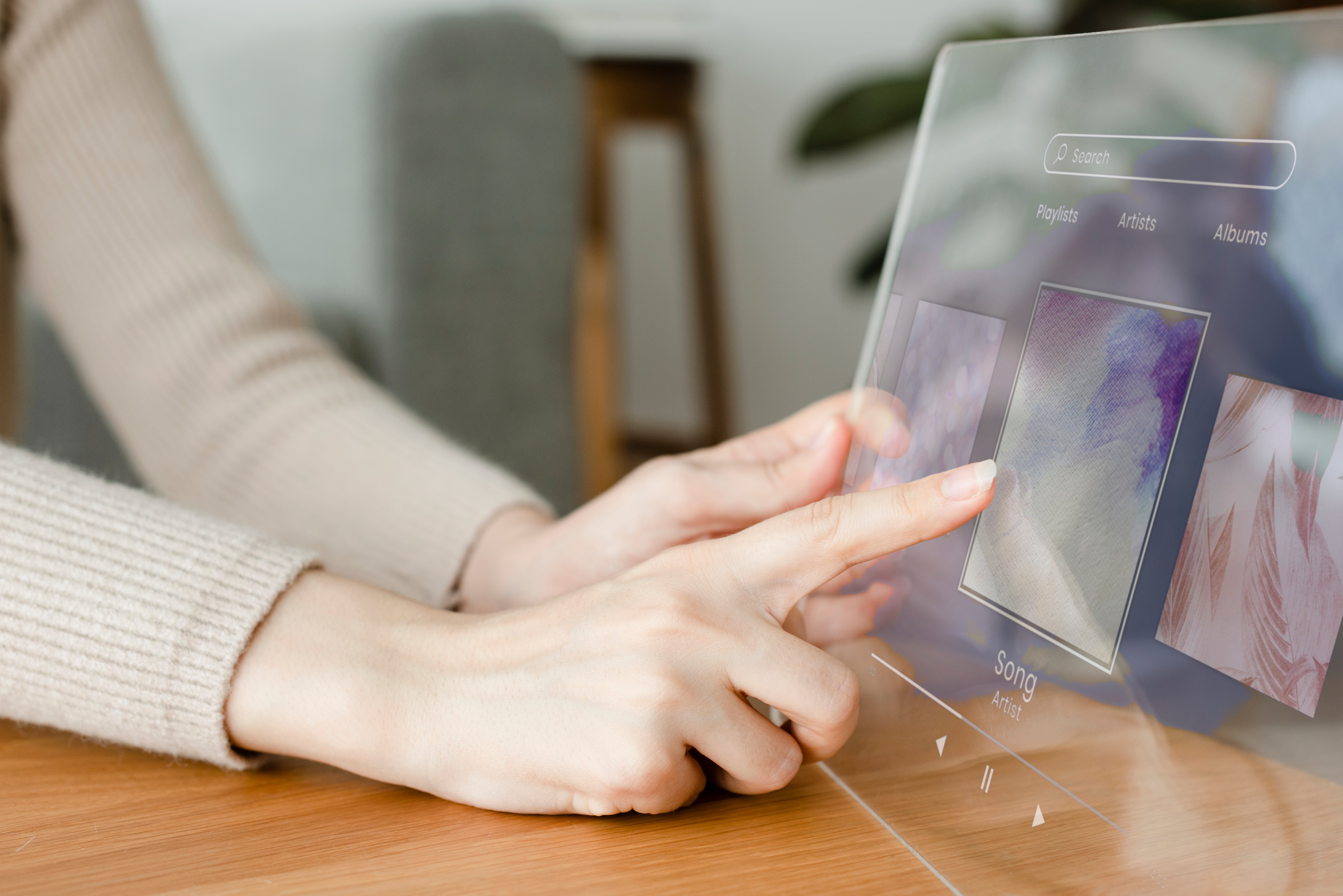 woman-using-transparent-tablet-play-music-innovative-technology